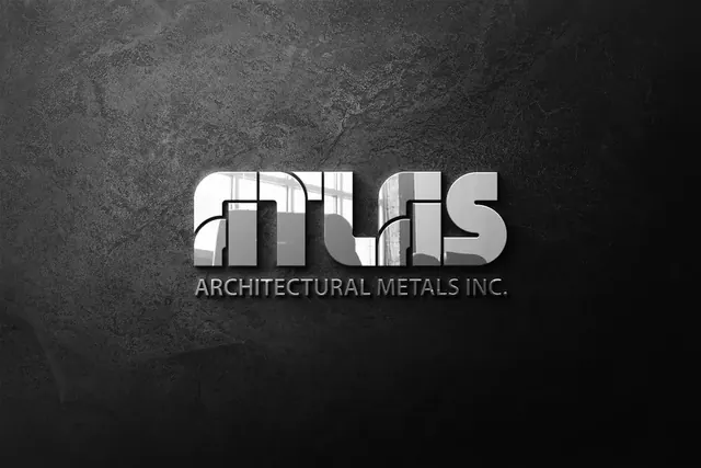Atlas Architectural Metals logo in chrome letters on a dark stone wall