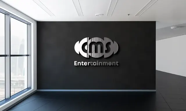 CMS Entertainment logo on a dark office wall
