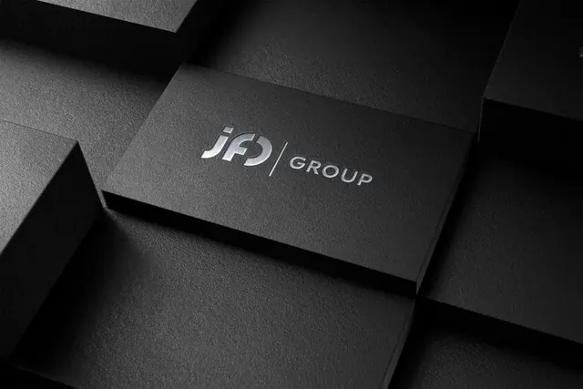 JFO Group logo debossed on black business cards