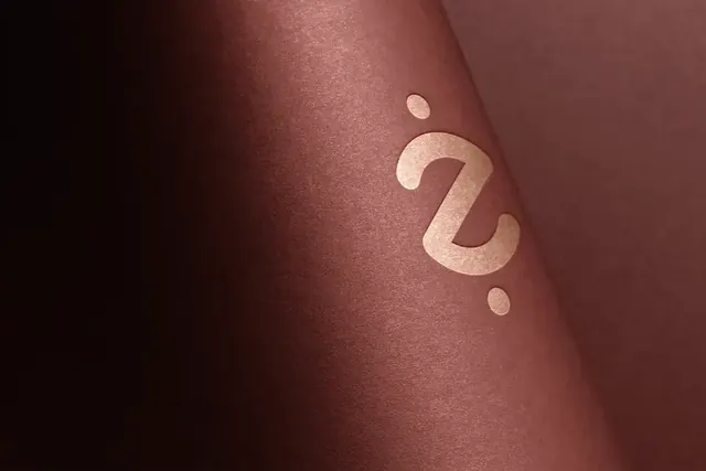 Zentavos mark embossed on rose-colored paper