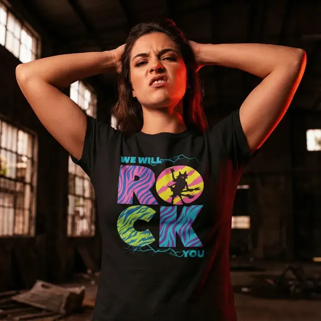 Woman wearing a black t-shirt with colorful We Will Rock You lettering