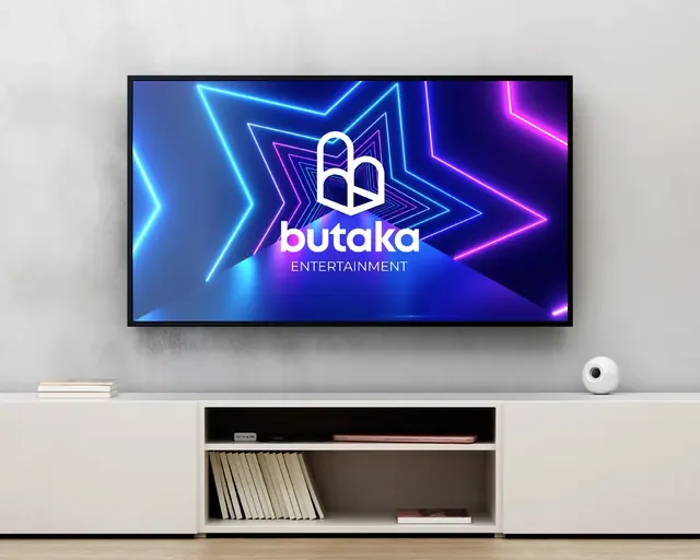 Butaka Entertainment logo on a wall-mounted TV with neon stars