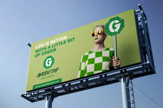 Green Stop Wellness billboard against a blue sky
