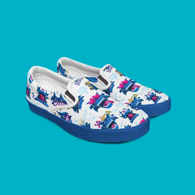 Slip-on shoes covered in a Lobo & Company wolf pattern on a teal background