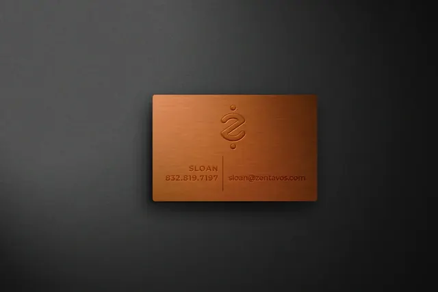 Zentavos copper business card on a dark surface