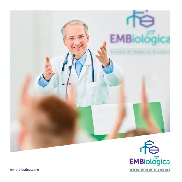 EMBiologica school of biological medicine post with a smiling doctor addressing an audience