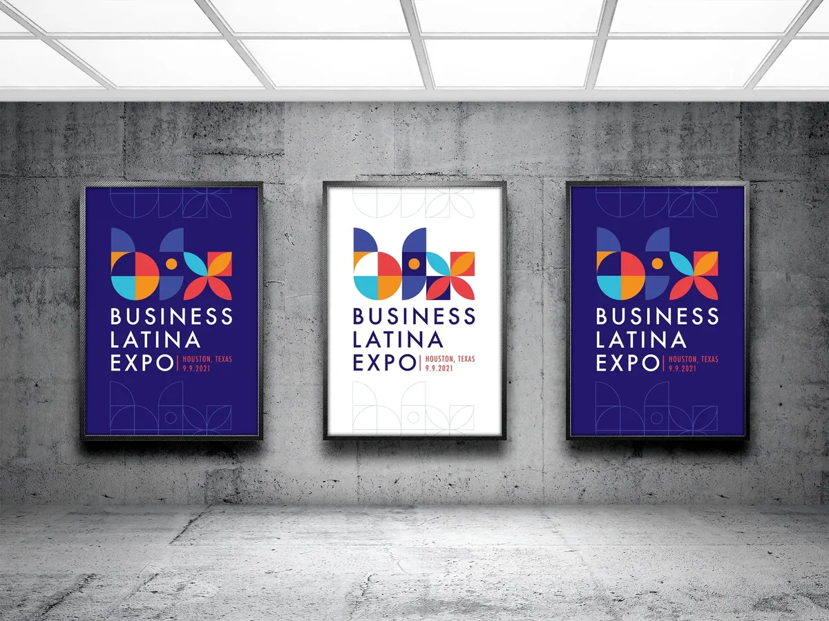 Three Business Latina Expo posters framed on a concrete wall
