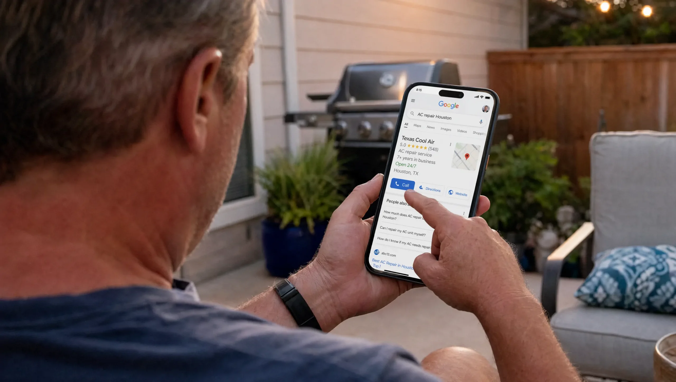 Houston homeowner searching Google on his phone and finding a top-ranked local service business ready to call